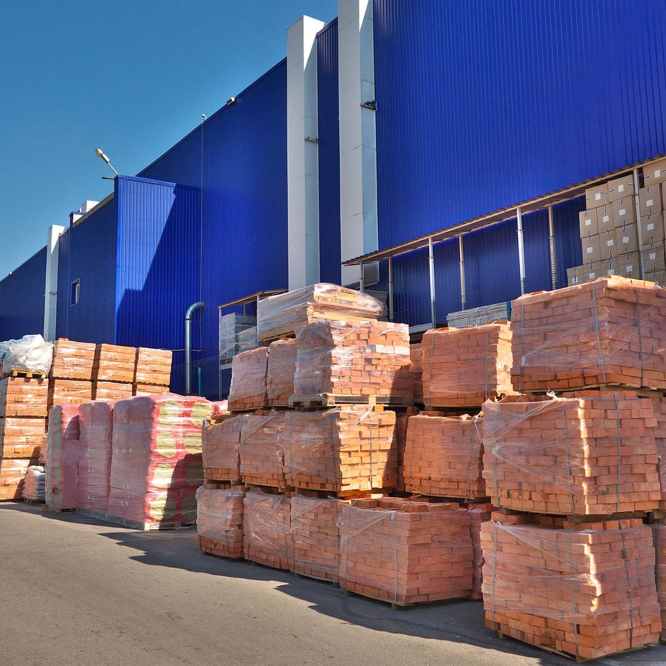Construction materials stacked near the warehouse